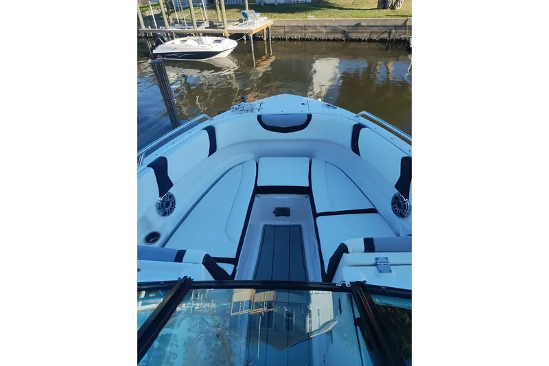Slide: The Image of 2024 Chaparral 250 OSX boat interior with sleek seating and modern design. - 15