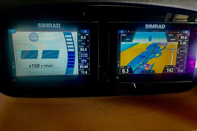 Slide: The Image of Simrad navigation display on 2024 Chaparral 250 OSX boat, showing engine and map data. - 19