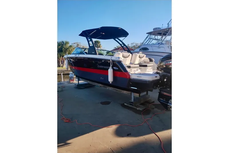 Slide: The Image of 2024 Chaparral 250 OSX boat on display, featuring sleek design and modern amenities. - 23