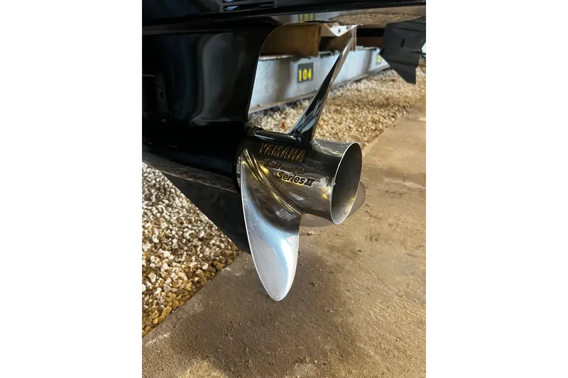 Slide: The Image of Close-up of a Yamaha propeller on a 2024 Chaparral 250 OSX boat. - 22