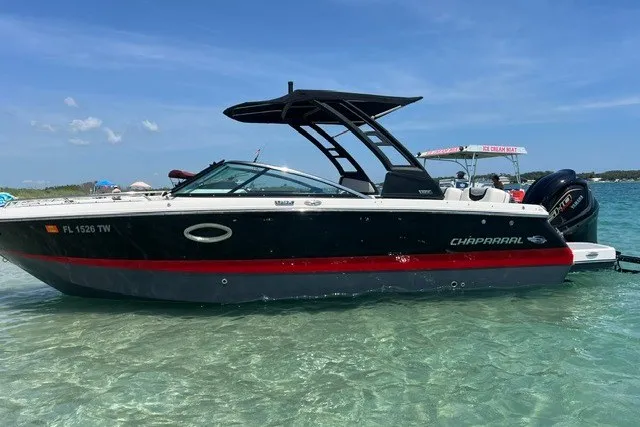 Slide: The Image of 2024 Chaparral 250 OSX boat in clear water, side view. - 8