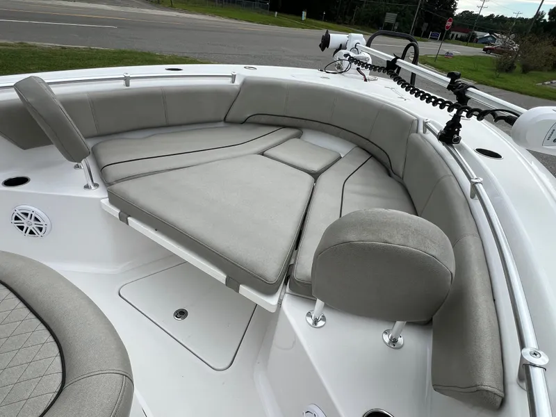 Slide: The Image of The image shows the bow area of a 2021 Sportsman Open 232 Center Console boat with gray cushions. - 43