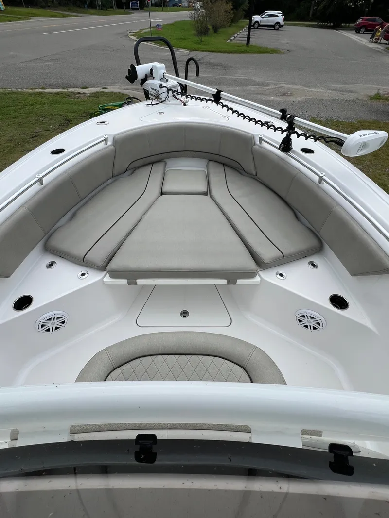 Slide: The Image of The image shows the bow of a 2021 Sportsman Open 232 Center Console boat with cushioned seating. - 39