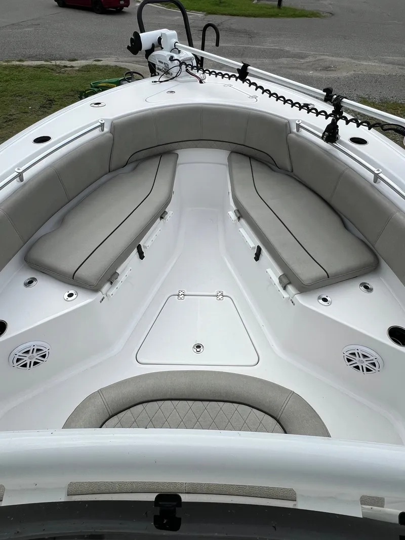 Slide: The Image of The image shows the bow of a 2021 Sportsman Open 232 Center Console boat with gray cushions. - 38