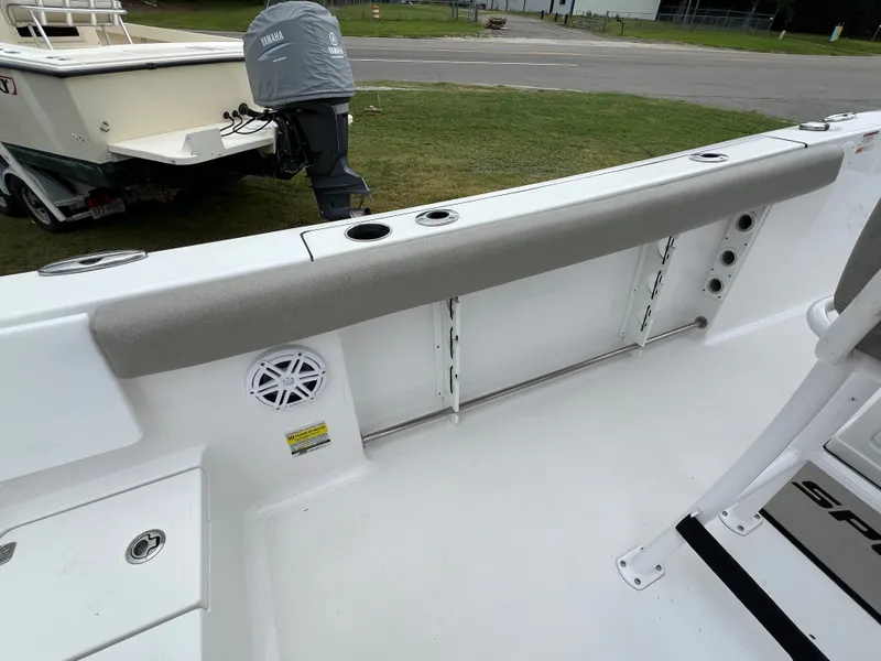 Slide: The Image of The image shows the stern of a 2021 Sportsman Open 232 Center Console boat with seating and a speaker. - 29
