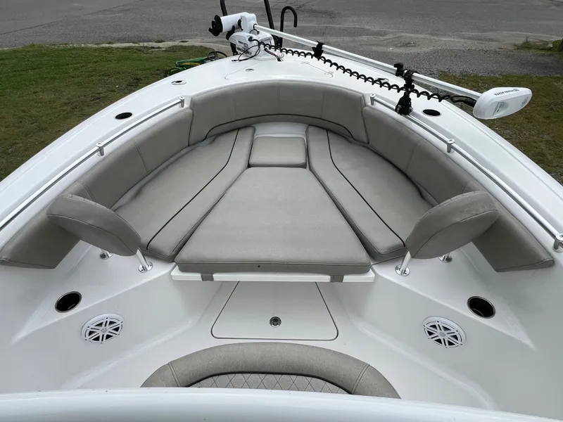 Slide: The Image of The image shows the bow of a 2021 Sportsman Open 232 Center Console boat with gray cushions. - 42