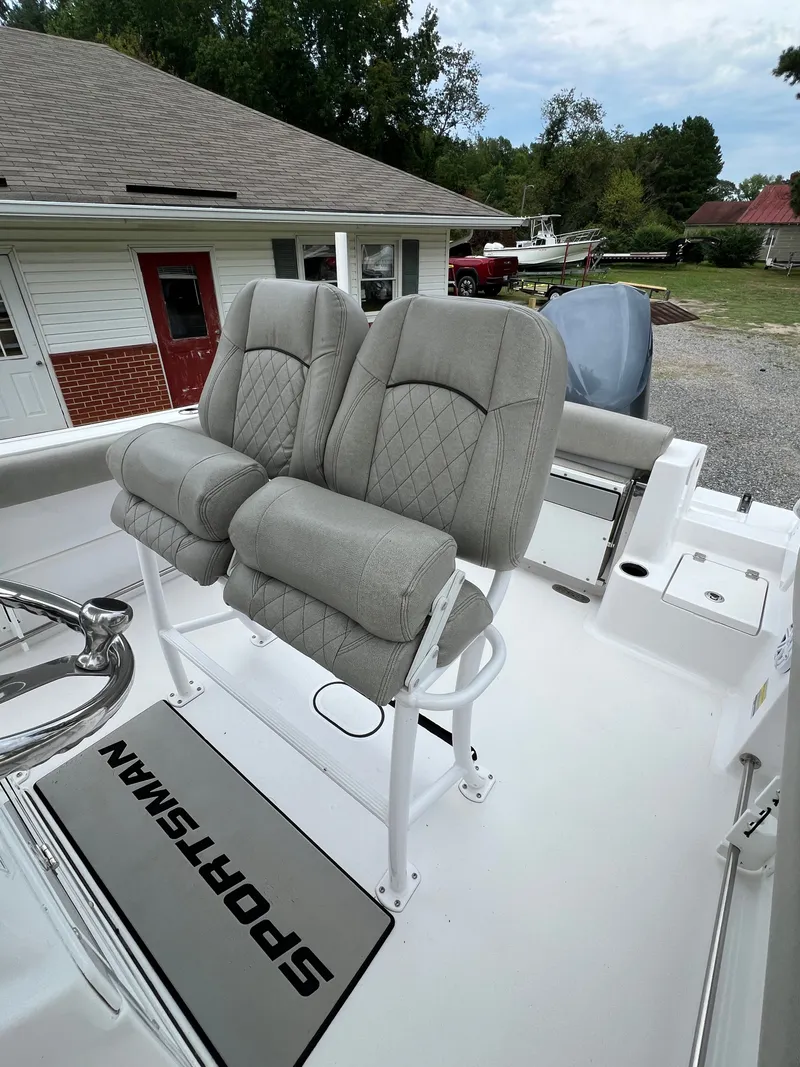 Slide: The Image of The image shows the seats of a 2021 Sportsman Open 232 Center Console boat. - 23