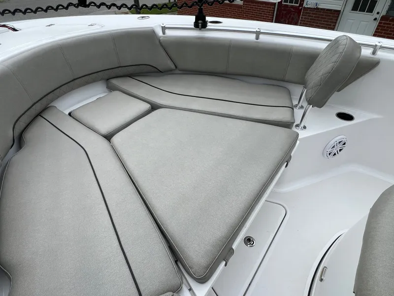 Slide: The Image of The 2021 Sportsman Open 232 Center Console features a spacious, cushioned seating area at the bow. - 45