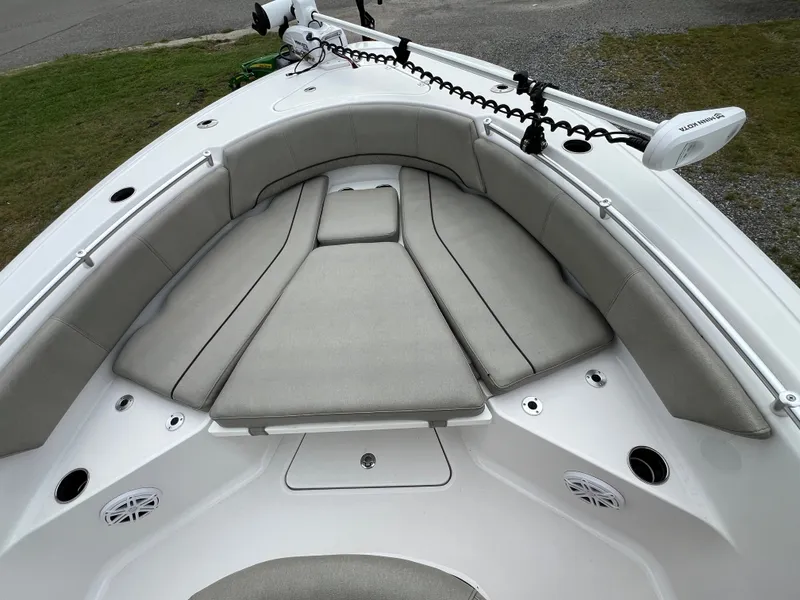 Slide: The Image of The image shows the bow of a 2021 Sportsman Open 232 Center Console boat with gray cushions. - 41