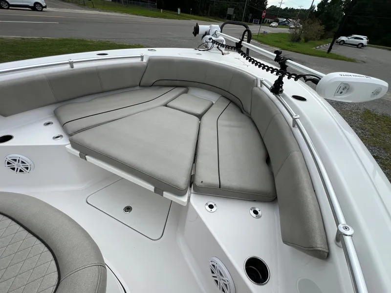 Slide: The Image of The image shows the bow area of a 2021 Sportsman Open 232 Center Console boat with gray cushions. - 40
