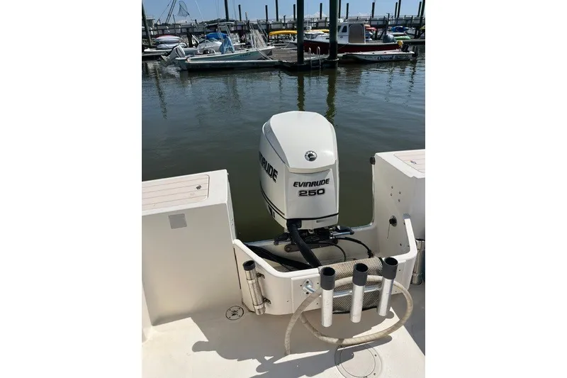 Slide: The Image of 2001 Parker 2320 Sport Cabin boat with Evinrude 250 outboard motor at marina. - 3