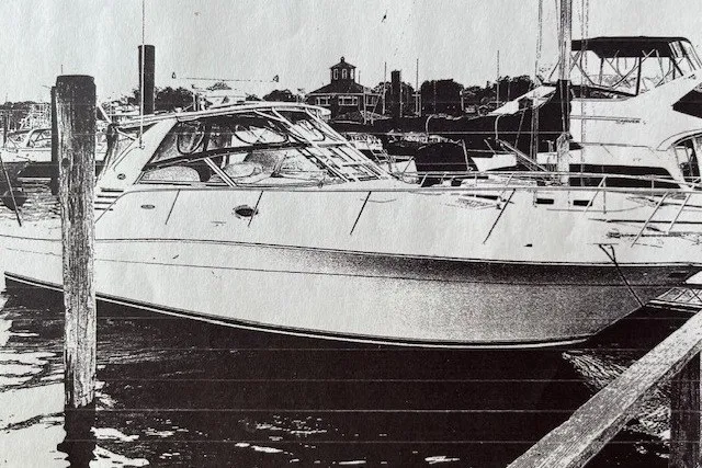 Slide: The Image of 2001 Sea Ray 340 Amberjack docked at a marina, side view. - 11