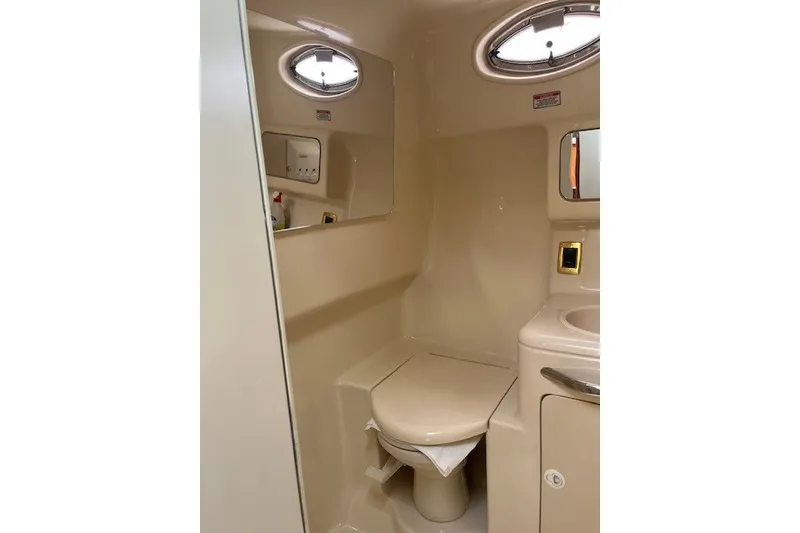 Slide: The Image of 2001 Sea Ray 340 Amberjack bathroom interior with toilet and sink. - 9