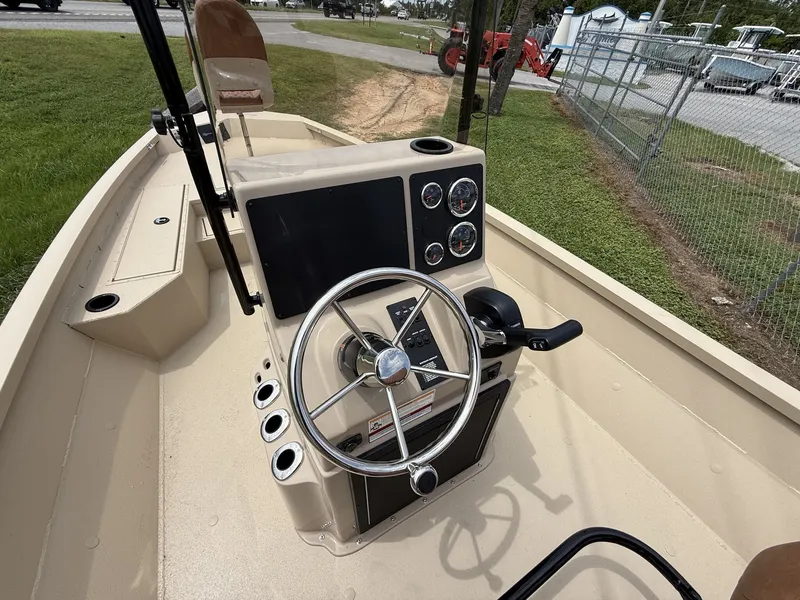 Slide: The Image of The image shows the helm of a G3 Bay GX21 boat with a 175HP engine. - 10