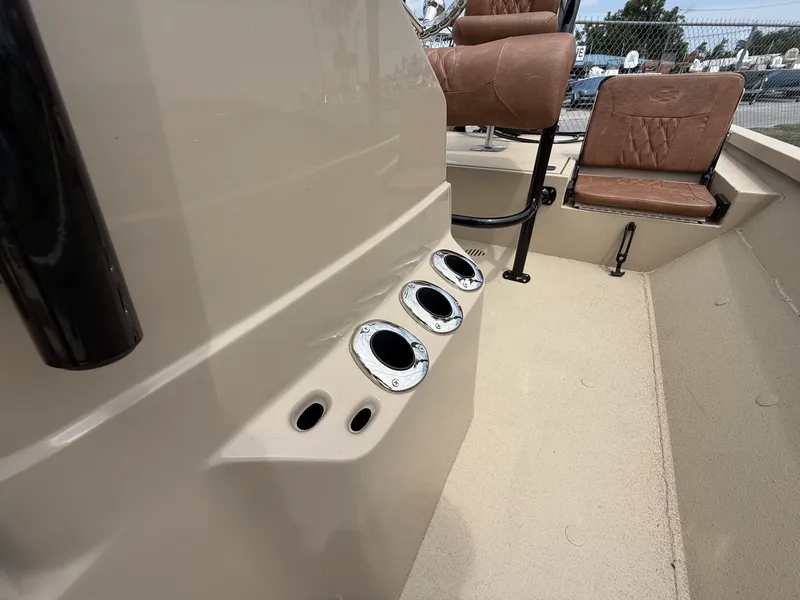 Slide: The Image of Close-up of a G3 Bay GX21 boat interior with brown seats and fishing rod holders. - 8