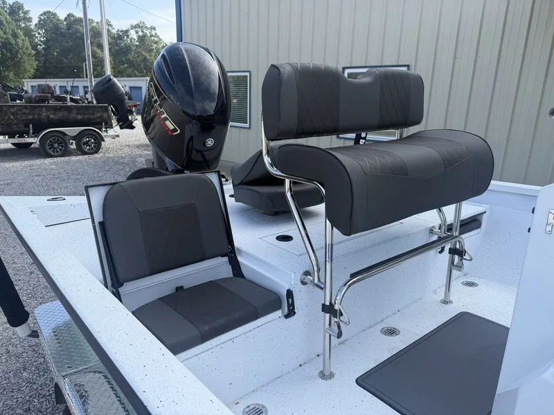 Slide: The Image of The image shows the cockpit of an Xpress Hyper-Lift Bay Series H22B-175 SHO boat with gray seating and an outboard motor. - 3