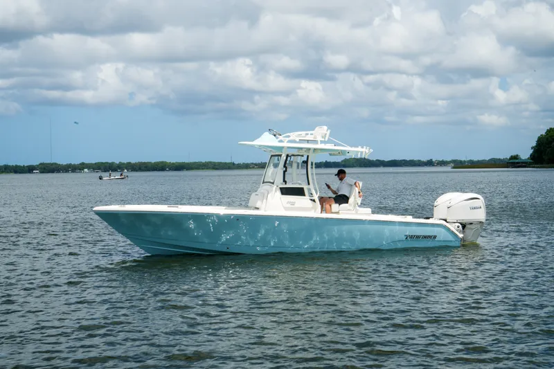 Slide: The Image of 2027 Pathfinder 2800 Hybrid boat on calm water under cloudy sky. - 14