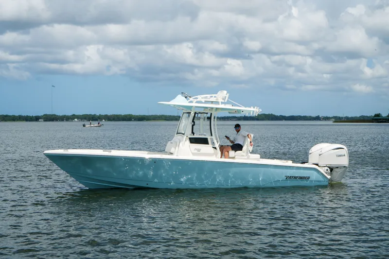 Slide: The Image of 2027 Pathfinder 2800 Hybrid boat on calm water under cloudy sky. - 15