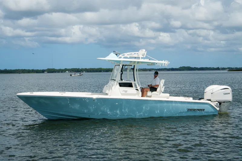 Slide: The Image of Pathfinder 2800 Hybrid boat on water, 2027 model, with Yamaha engine, under cloudy sky. - 16
