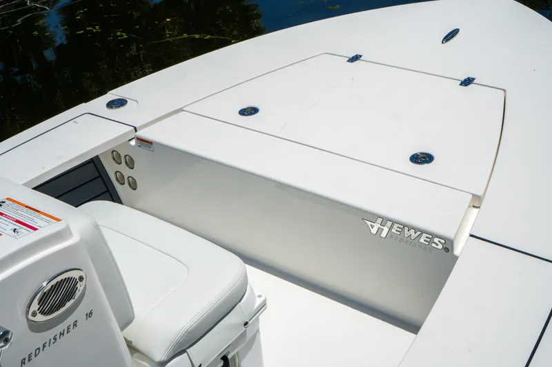 Slide: The Image of 2027 Hewes Redfisher 16 boat interior, showcasing sleek design and storage compartments. - 26