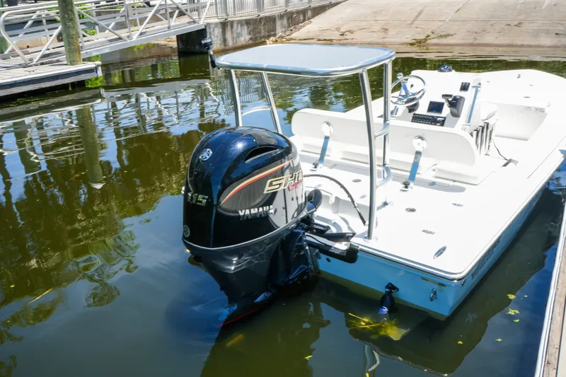 Slide: The Image of 2027 Hewes Redfisher 16 boat with Yamaha engine docked in calm waters. - 20
