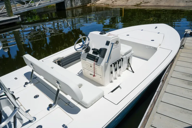 Slide: The Image of 2027 Hewes Redfisher 16 boat docked, showcasing sleek design and modern features. - 16