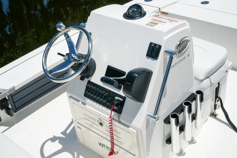 Slide: The Image of 2027 Hewes Redfisher 16 boat console with steering wheel and controls. - 24