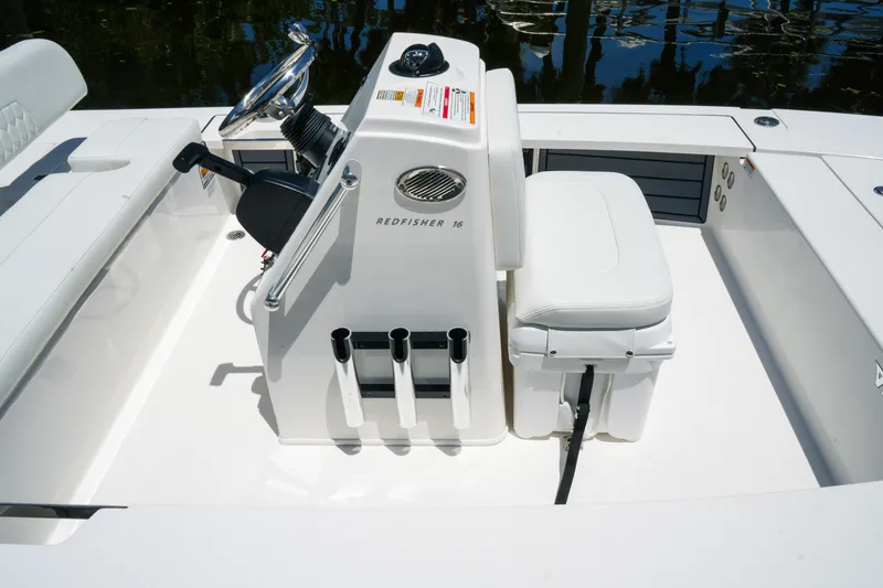 Slide: The Image of 2027 Hewes Redfisher 16 boat interior with steering console and seating. - 13