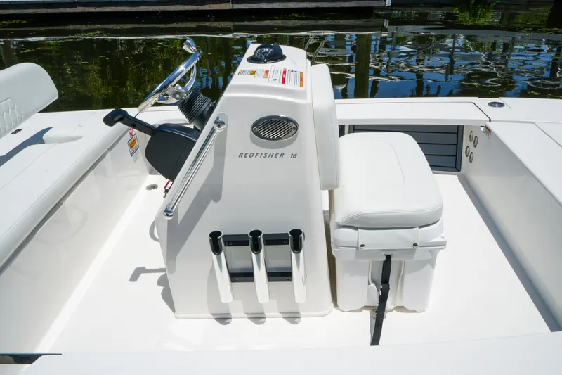 Slide: The Image of 2027 Hewes Redfisher 16 boat interior with steering console and seating. - 14