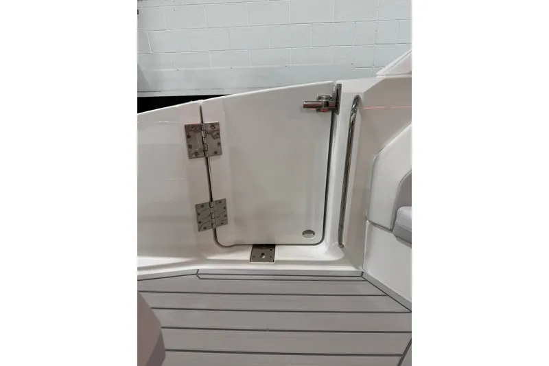 Slide: The Image of 2026 Formula 360 Crossover Bowrider I/O boat door with stainless steel hinges and handle. - 27