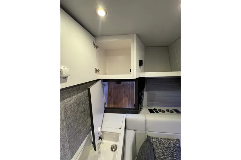 Slide: The Image of Interior of 2026 Formula 360 Crossover Bowrider I/O, featuring modern cabinetry and seating. - 170