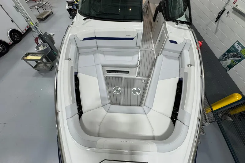 Slide: The Image of 2026 Formula 360 Crossover Bowrider I/O with spacious seating and sleek design in a showroom. - 102
