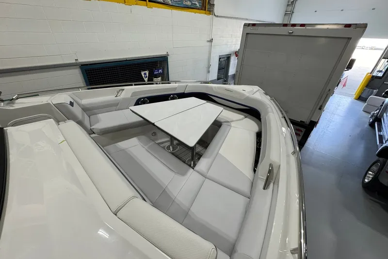 Slide: The Image of 2026 Formula 360 Crossover Bowrider I/O interior with sleek seating and table setup. - 119
