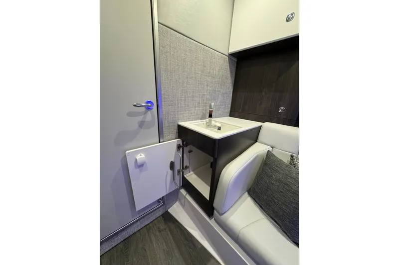 Slide: The Image of Interior of 2026 Formula 360 Crossover Bowrider I/O, featuring sleek sink and seating area. - 172