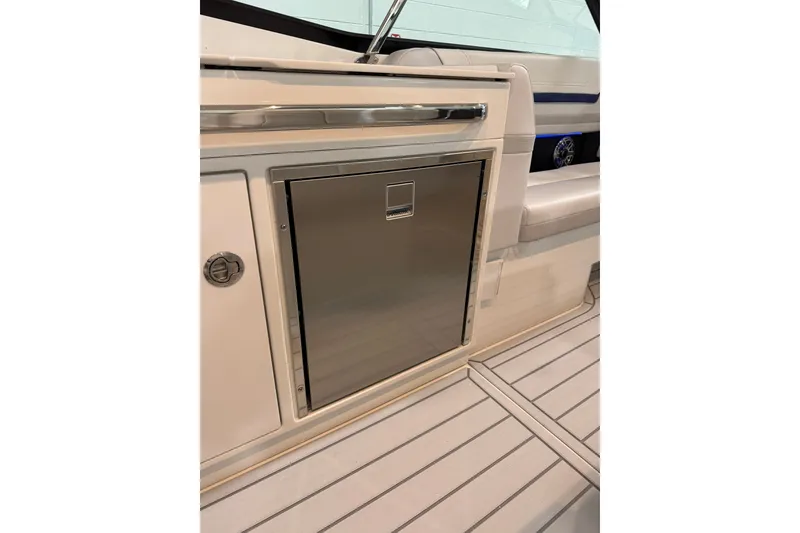 Slide: The Image of 2026 Formula 360 Crossover Bowrider I/O interior with stainless steel cabinet and seating. - 37