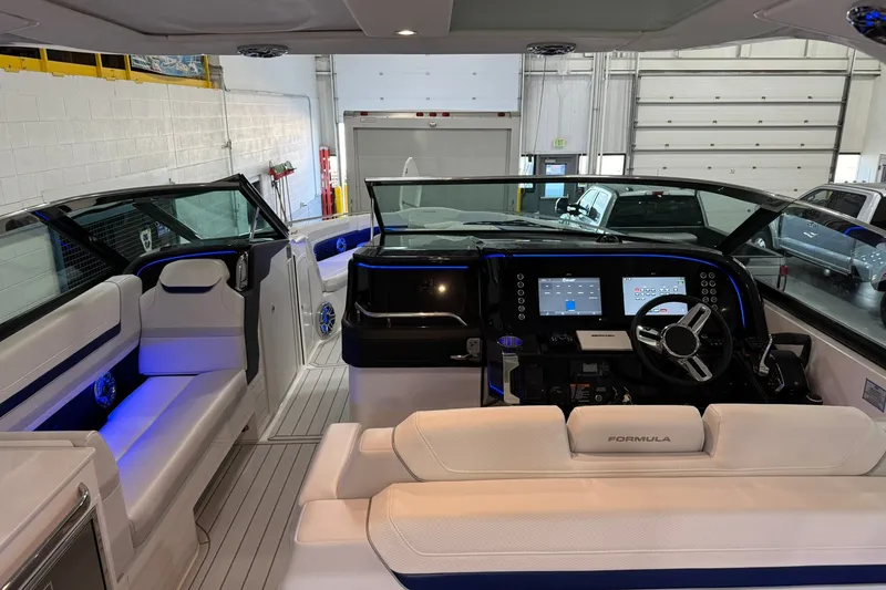 Slide: The Image of Interior view of 2026 Formula 360 Crossover Bowrider I/O with modern dashboard and seating. - 93
