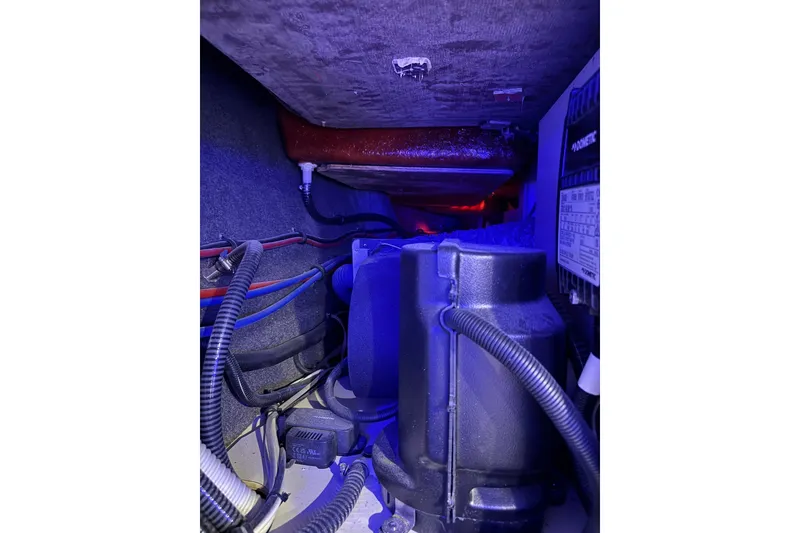 Slide: The Image of Engine compartment of 2026 Formula 360 Crossover Bowrider I/O with visible wiring and components. - 165