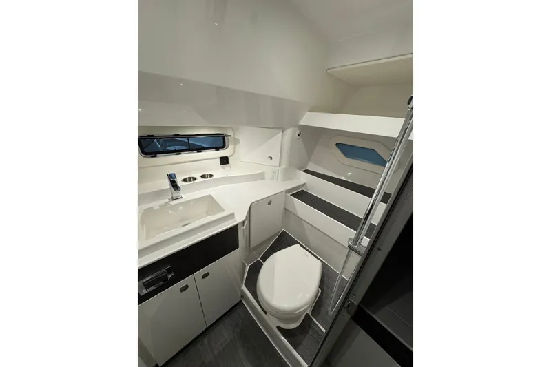 Slide: The Image of 2026 Formula 360 Crossover Bowrider I/O bathroom with modern fixtures and sleek design. - 9