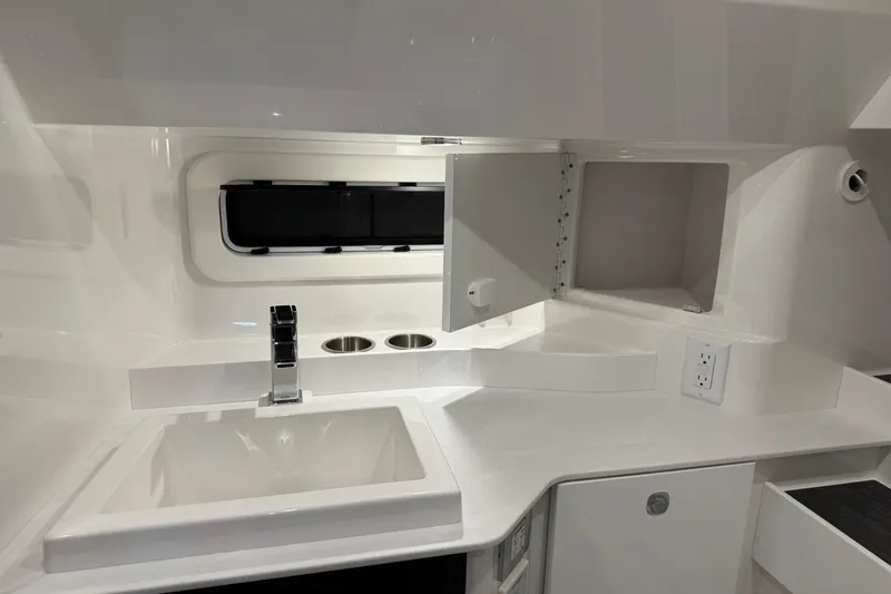 Slide: The Image of Interior of 2026 Formula 360 Crossover Bowrider I/O, featuring a sleek sink and storage area. - 185
