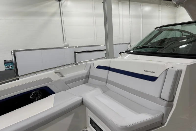 Slide: The Image of 2026 Formula 360 Crossover Bowrider I/O interior with sleek white seating and modern design. - 107