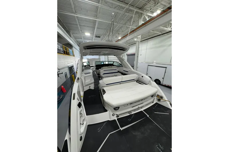 Slide: The Image of 2026 Formula 360 Crossover Bowrider I/O in showroom, showcasing spacious seating and sleek design. - 17