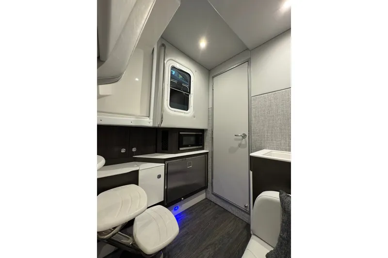 Slide: The Image of Interior of 2026 Formula 360 Crossover Bowrider I/O, featuring modern kitchenette and seating. - 144