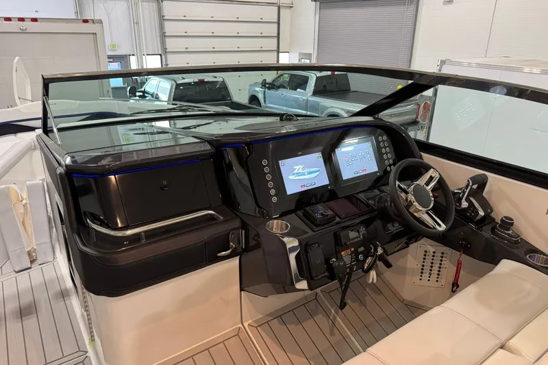 Slide: The Image of 2026 Formula 360 Crossover Bowrider I/O dashboard with dual screens and modern controls. - 75