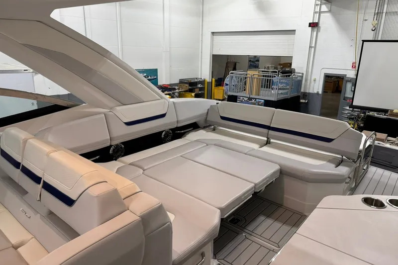 Slide: The Image of 2026 Formula 360 Crossover Bowrider I/O interior with luxurious seating in a showroom. - 63