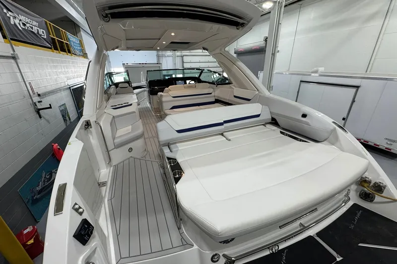 Slide: The Image of 2026 Formula 360 Crossover Bowrider I/O in showroom, featuring spacious seating and sleek design. - 45
