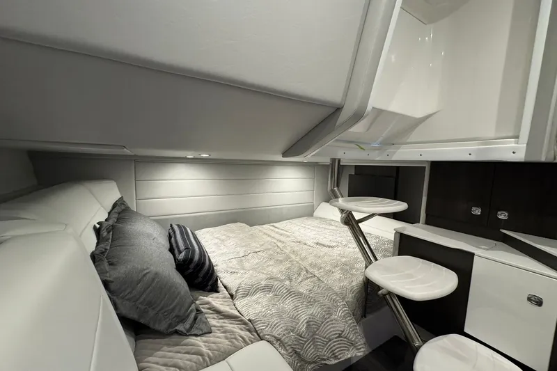 Slide: The Image of Luxurious cabin interior of 2026 Formula 360 Crossover Bowrider I/O with modern bedding and seating. - 136