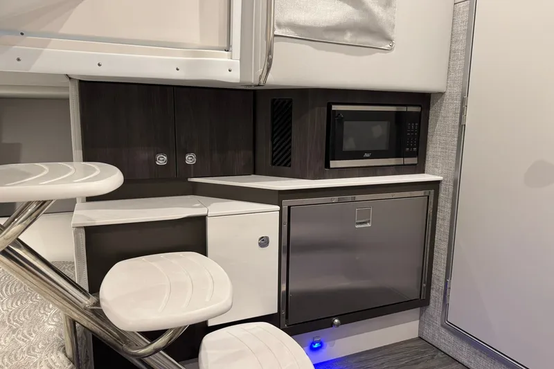 Slide: The Image of Interior of 2026 Formula 360 Crossover Bowrider I/O with modern kitchenette and seating. - 141