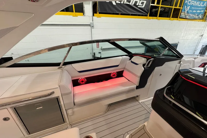 Slide: The Image of 2026 Formula 360 Crossover Bowrider I/O interior with sleek seating and ambient lighting. - 39