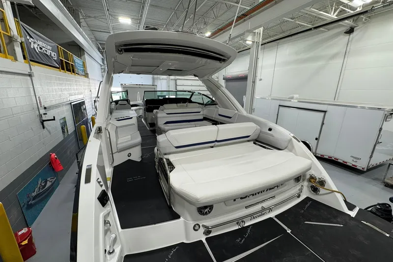 Slide: The Image of 2026 Formula 360 Crossover Bowrider I/O in a showroom, showcasing luxury seating and design. - 18