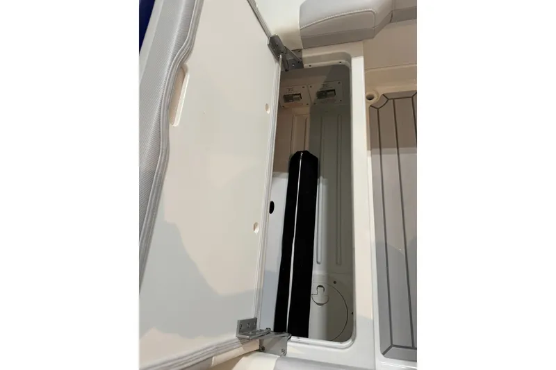 Slide: The Image of Storage compartment in 2026 Formula 360 Crossover Bowrider I/O boat, open lid view. - 69